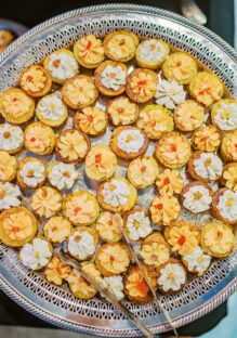 DailyDish's bliss potatoes hors d'oeuvres served on a silver platter with tongs. Catering Franklin TN